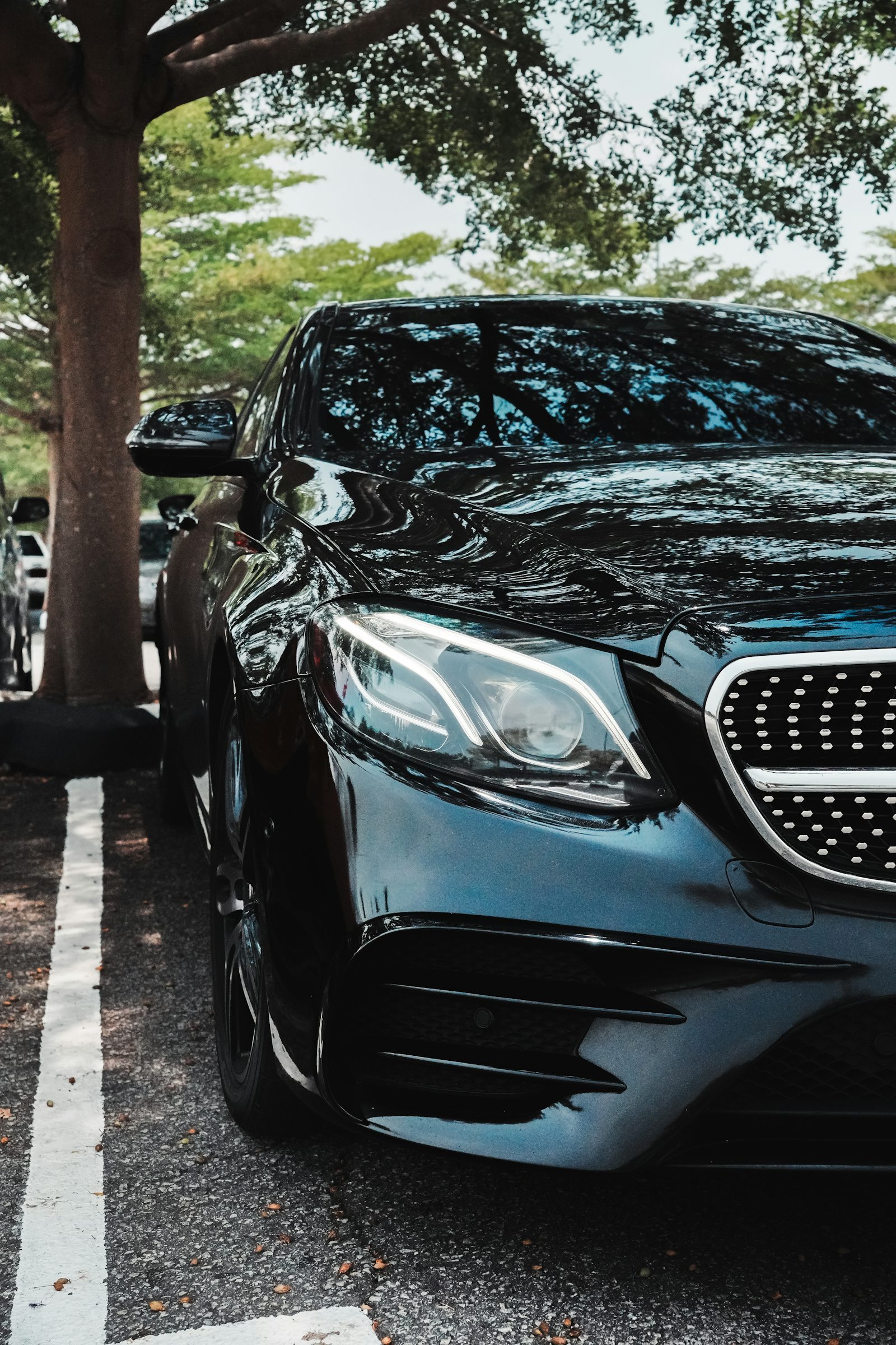 Freshly detailed black luxury sedan with mirror gloss paint